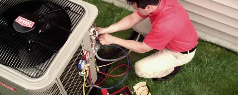 HVAC technician servicing an outdoor air conditioner unit in Anaheim, CA