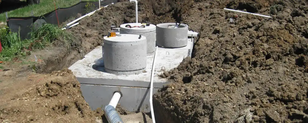 Septic system repair and installation site with tank access ports in Anaheim, CA