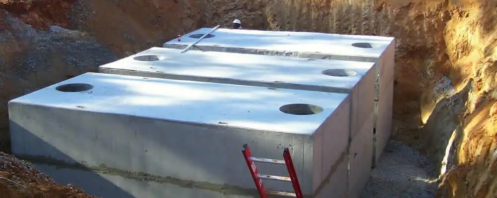 Septic tank installation site with a newly placed concrete tank in Anaheim, CA